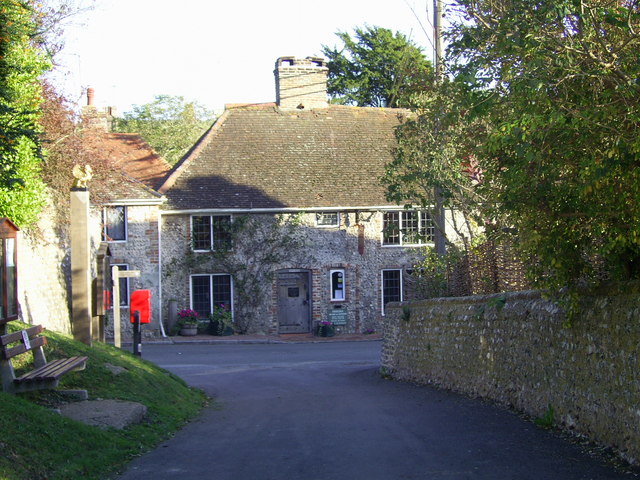 The Hungry Monk restaurant on Jevington Road in 2006, a low flint cottage with a red sign