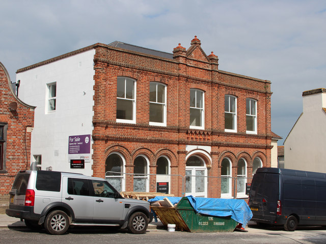 The former drill hall on Broad Street, Seaford, a plain brick building with tall arched windows