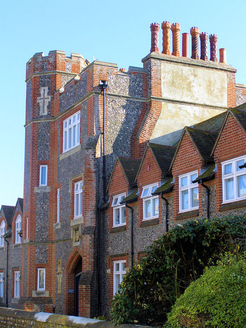 The Fitzgerald almshouses in Croft Lane, Seaford, showing the castellated tower and tall mock-Tudor chimneys