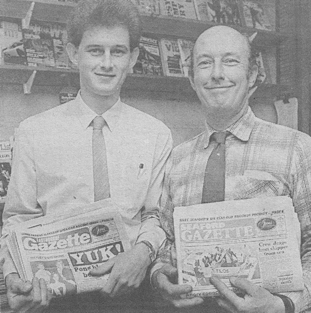 John Wood and a younger colleague holding copies of the Seaford Gazette in 1988